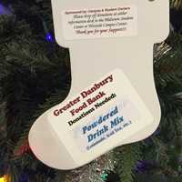 <p>The Christmas tree in the Western Connecticut State University midtown campus student center is decorated with ornaments that list items needed by the Greater Danbury Food Bank.</p>