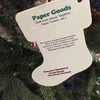 <p>The Christmas tree in the Western Connecticut State University midtown campus student center is decorated with ornaments that list items needed by the Greater Danbury Food Bank.</p>