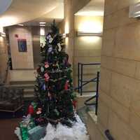 <p>The Christmas tree in the Western Connecticut State University midtown campus student center is decorated with ornaments that list items needed by the Greater Danbury Food Bank.</p>