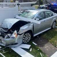 Crash Sends Sedan Through Fair Lawn Homeowner's Fence