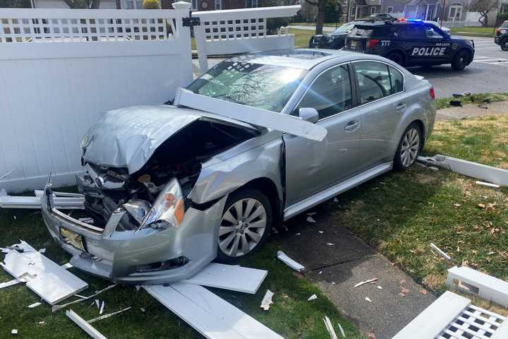 Crash Sends Sedan Through Fair Lawn Homeowner's Fence