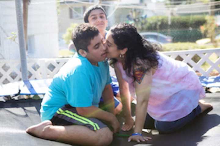 Aidan, his mom Johanna and brother Dailey (rear).