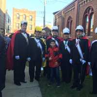 <p>Members of the Knights of Columbus’s St. Matthew Norwalk Council 14360 pose with a young parishioner of The Shrine Church of Our Lady of Solace on Saturday, Dec. 20.</p>