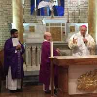 <p>Bishop Nicholas DeMarzio consecrates the altar at The Shrine Church of Our Lady of Solace in Coney Island. The church was badly damaged by Superstorm Sandy in 2012.</p>