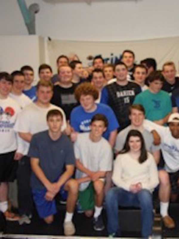Darien High School Football Team Lifts For A Good Cause