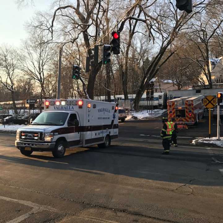 An ambulance leaves the scene at about 8:10 a.m. after a woman was hit by a train at the Valhalla Metro-North station on Monday.