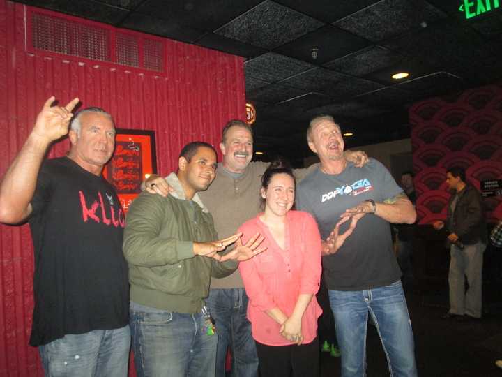 Wrestling fans pose with Scott Hall, Jake &quot;The Snake&quot; Roberts and &quot;Diamond&quot; Dallas Page at The Alamo Drafthouse in Yonkers. 