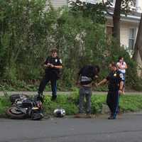 <p>A motorcyclist shows some scrapes on his side and his leg from the crash Tuesday in Danbury.</p>