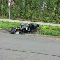 <p>The motorcycle landed along the curb on Town Hill Avenue in Danbury after a collision with a car.</p>