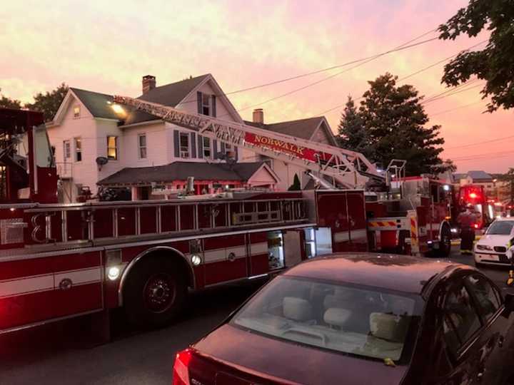 Norwalk Fire Department responds to a house fire on Grove Street Thursday, Sept. 5 which displaced 16 residents.