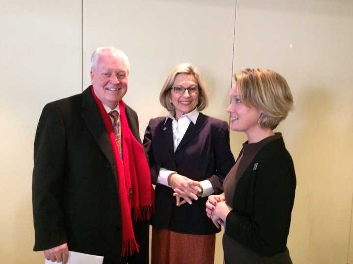 Fairfield First Selectman Michael Tetreau, left, chats with Stephanie Barnes, right, president of the Greater Fairfield Board of Realtors.