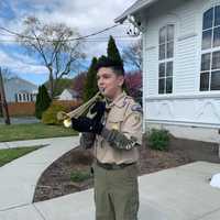 <p>MMS seventh grader William Hansen of Troop 60 performed &quot;Taps&quot; on the trumpet in memory of Gerry Genuino.</p>