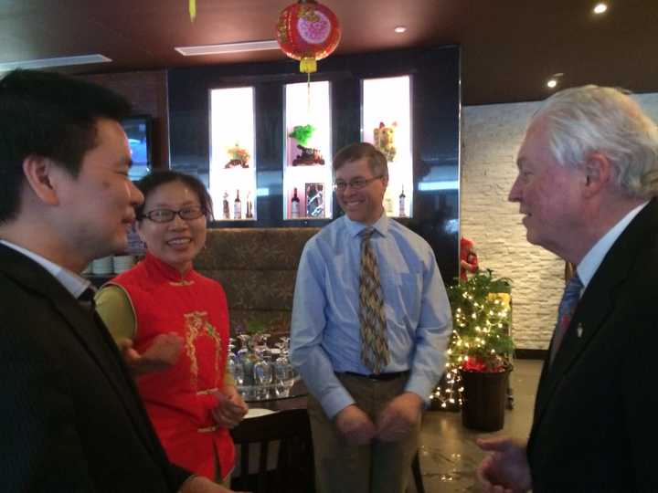 Owner Allen Chen, translator Cindy Pan, Economic Development Director Mark Barnhart and First Selectman Michael Tetreau share a laugh at Jinn&#x27;s Fresh Noodle House and Cafe.