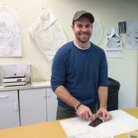 <p>Michael Skrtic cutting glass at The Glass Source in Shelton</p>