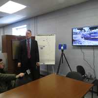 <p>Westchester County Police Sgt. James Harrison demonstrating the 3-D laser camera.</p>