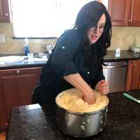 <p>Step 8: Once doubled in size, pound the dough down to get all the air bubbles out.</p>