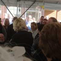 <p>Dr. Kristine Lisi, the center&#x27;s Medical Director, center facing camera, celebrates her birthday with the crowd at the dedication of the new health center in Danbury.</p>