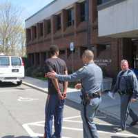 <p>Jean Pierre-Filtcher, 24, of New Rochelle and his attorney after Filtcher&#x27;s arraignment Tuesday afternoon at Harrison Town Court on menacing, disorderly conduct and obstructing governmental administration charges.</p>