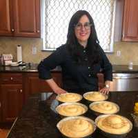 <p>Kaminker with her loaves as they rise for a second time.</p>