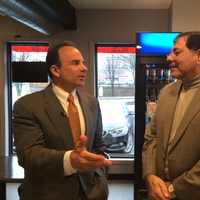 <p>Mayor Joseph P. Ganim talks business with Wing It On! owner Hosam Afifi.</p>