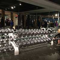 <p>Gleaming new free weights line one wall at BDx Fitness in Shelton.</p>