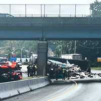 <p>Two lanes on southbound Route 17 in Mahwah and one on the north side were initially closed as a state Department of Transportation used a front-loader to offload the trash.</p>