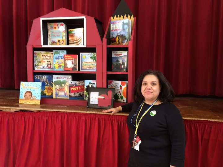 Librarian Lissette Valle will add the new barn bookcase to Park City Magnet School&#x27;s library.