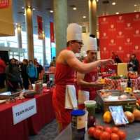 <p>Hunter &quot;Sunshine&quot; Boesch of Team Rugby chooses ingredients at Fairfield University&#x27;s student meatball competition.</p>