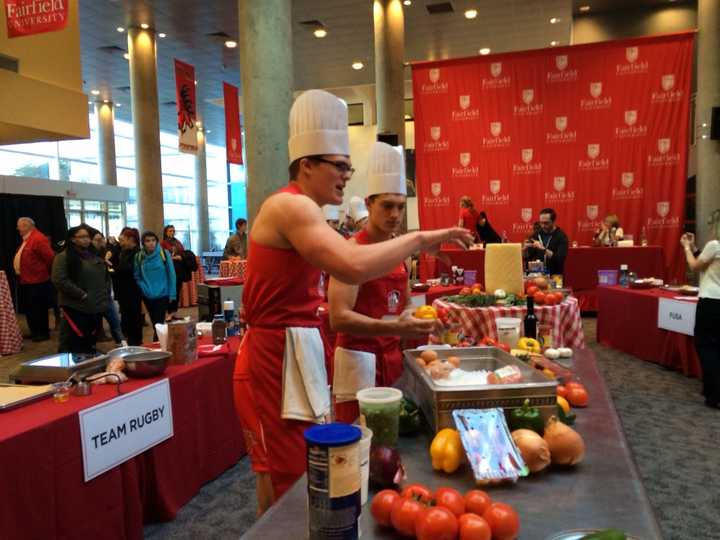 Hunter &quot;Sunshine&quot; Boesch of Team Rugby chooses ingredients at Fairfield University&#x27;s student meatball competition.