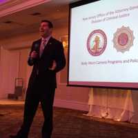 <p>New Jersey Division of Criminal Justice Director Elie Honig addresses the crowd.</p>