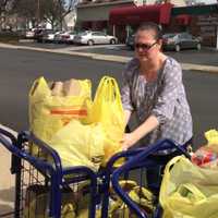 <p>Laura Sabatello loads groceries at the Fair Lawn Food Pantry Wednesday.</p>