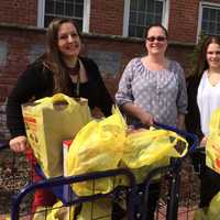 <p>Liz Twiggs, Laura Sabatello and Melissa Traverso with food donations in Fair Lawn.</p>