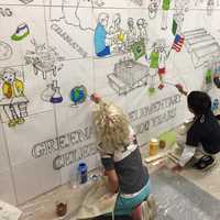 <p>Kids painting mural at Greenacres Elementary School</p>