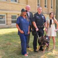 <p>New Rochelle residents Jennifer Ubl and Jessica Levine with Police Commissioner Patrick Carroll and K9 Officer Matthew Glass.</p>