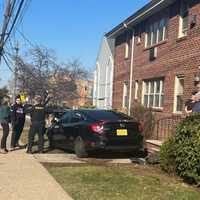 <p>Unexpected arrival at the door of tenants at the Polifly Arms Apartments in Hackensack.</p>