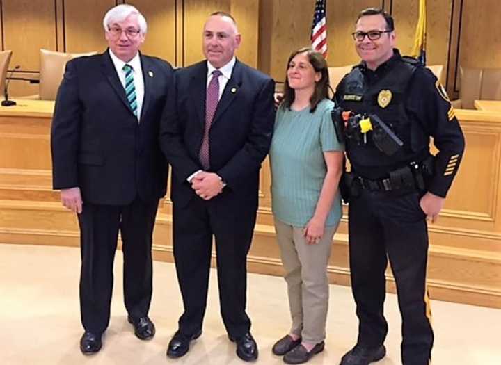 (From left:) Mahwah Mayor William Laforet, Detective Gerald Falotico, wife Sharon Falotico, brother Ramsey Police Sgt. Richard Falotico