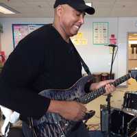 <p>Yankees legend Bernie Williams jams with students at Tisdale School last year.</p>