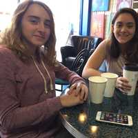 <p>Sarah, left, and Gabby, 13 of Maywood, &quot;chill&quot; at Stray Cat Brew in Maywood.</p>