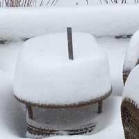 <p>The deck furniture is almost completely buried by snow at this home in North Wilton — and even more snow is headed our way on Thursday.</p>