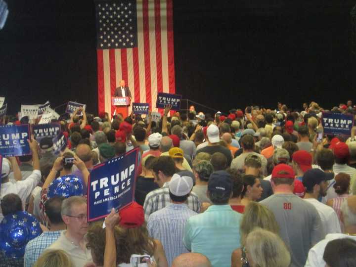 Trump-Pence signs fill the gym at the rally at Sacred Heart University as Donald Trump rallies the crowd on Saturday night.