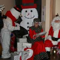 <p>Santa, Mrs. Claus, and Frosty the Snowman surprised the children at Sunshine Children&#x27;s Home with a police-escorted visit on their sleigh.</p>