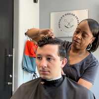 <p>Monica Dooley works on a client at her shop, Monica&#x27;s Shear Images, in Arlington.</p>