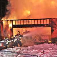 <p>Mahopac Falls firefighters battled a large house fire.</p>