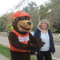 <p>The Briarcliff Bear and event organizer Debbie Johnson at the Ragamuffin parade.</p>