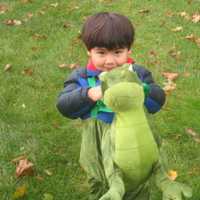 <p>A dragon enjoys the Briarcliff Ragamuffin Parade.</p>