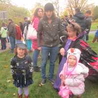 <p>A police officer, Maleficent and Olaf prepare to march in the Ragamuffin Parade.</p>