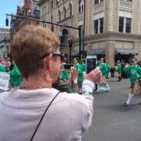 <p>A mom snaps a photo of marchers from Fairfield&#x27;s St. Thomas Aquinas School at 2016 St. Patrick&#x27;s Day Parade in Bridgeport.</p>