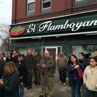 <p>A crowd gathers on East Main Street sidewalks.</p>