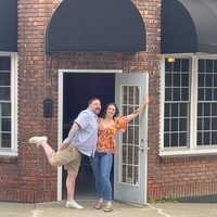 <p>Two of the owners at the site of the new restaurant</p>