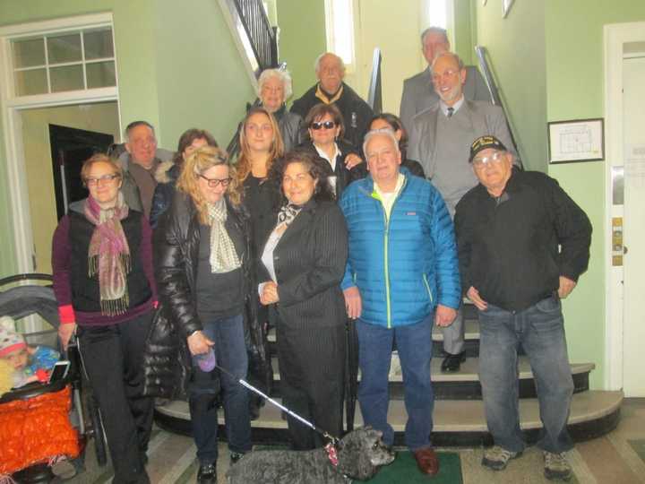 Ossining residents gathered at Village Hall to announce they had collected enough signatures to force a referendum on a proposed roundabout